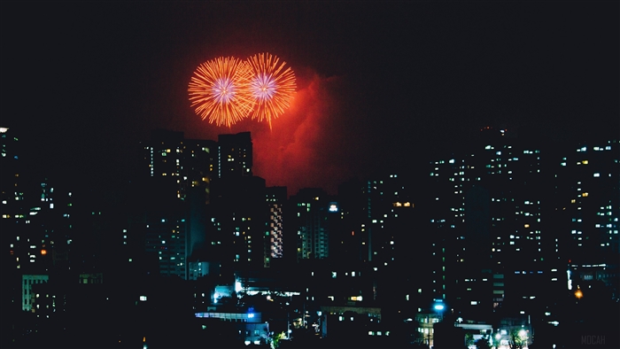 Fireworks over a city at night