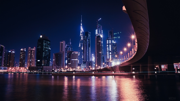 Dubai skyscrapers at night with water reflection 4K