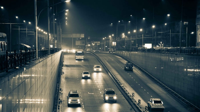 Night highway in Almaty with cars and street lights 4K