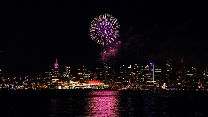 Fireworks over Vancouver skyline at night