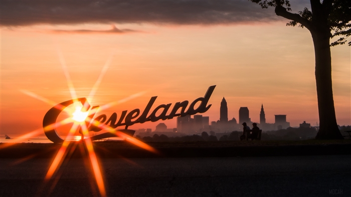 Cleveland skyline at sunset with inscription