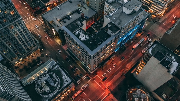Aerial view of a city intersection at night, 4K