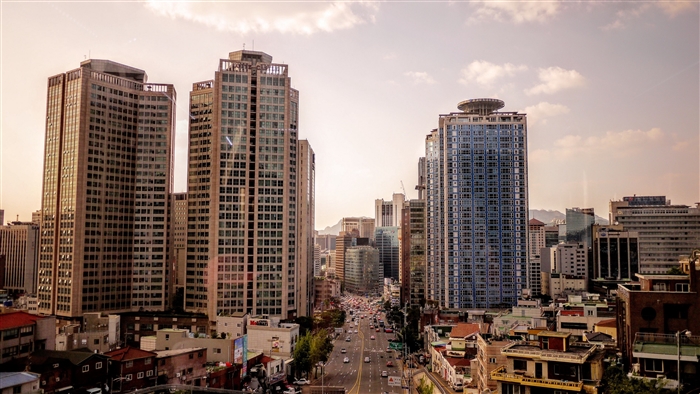 Cityscape with tall buildings and a busy road 4K