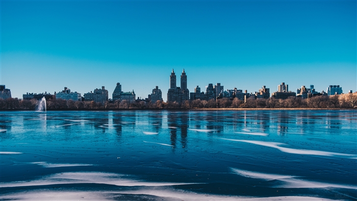 New York City skyline over frozen river