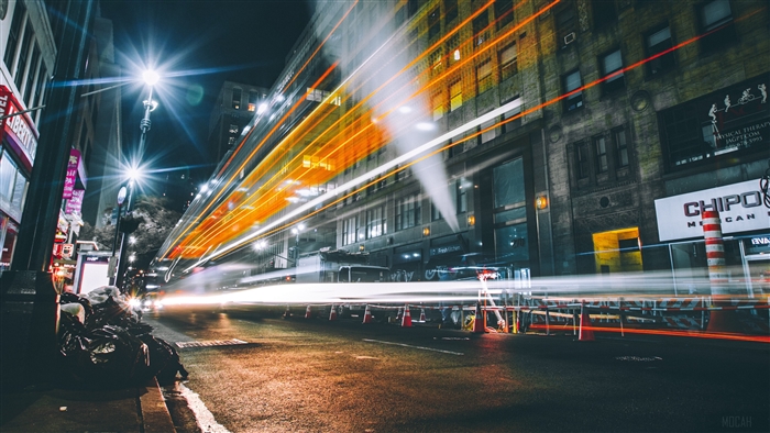 Night city street with light trails in New York 4K