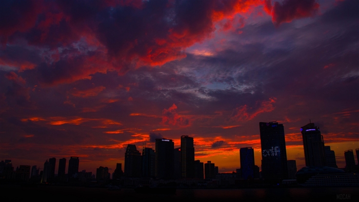 City skyline at sunset with dramatic clouds 4K