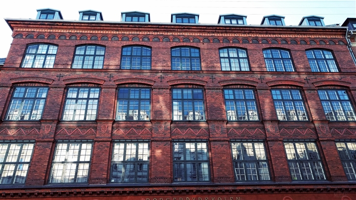 Brick building facade with multiple windows 4K