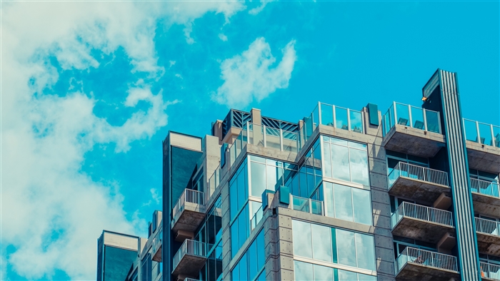 Modern building with glass facade and balconies