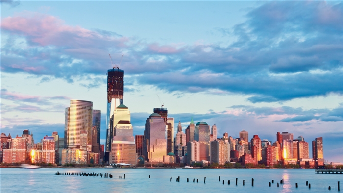 New York City skyline at sunset with clouds