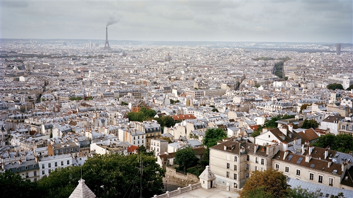 Paris skyline with Eiffel Tower and rooftops 4K