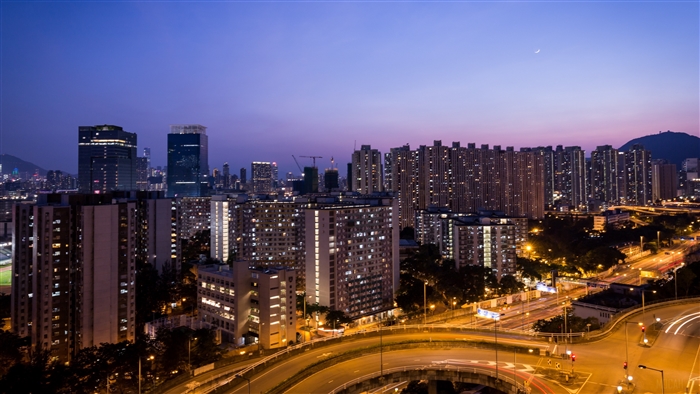 Night city skyline with skyscrapers and roads 4K