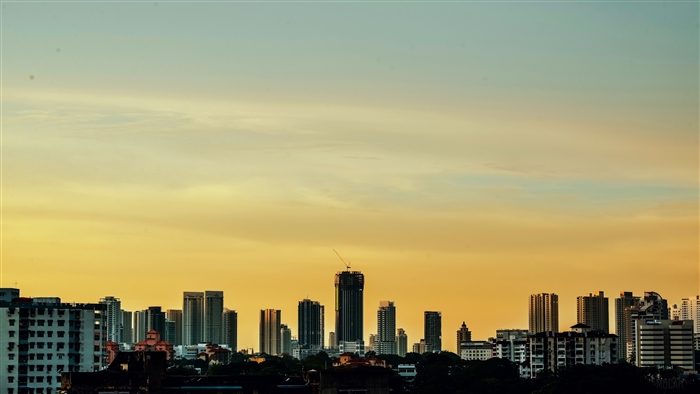 Cityscape with skyscrapers against a sunset sky 4K