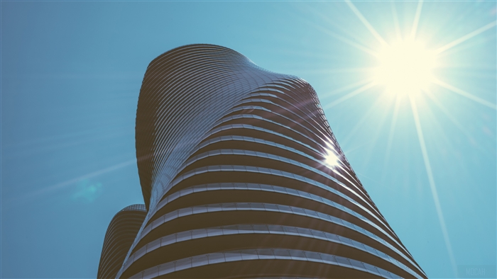 Curved skyscraper under bright sun