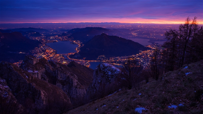 Night city lights from mountain view 4K