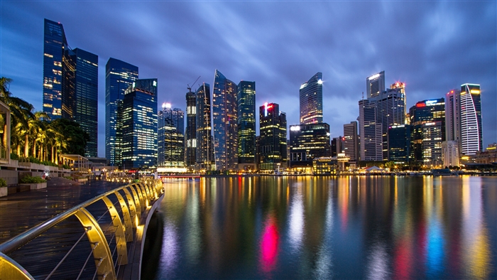 Singapore skyline at night with reflections