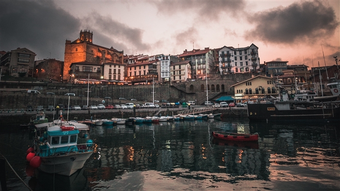 Fishing town with boats and buildings in Spain 4K