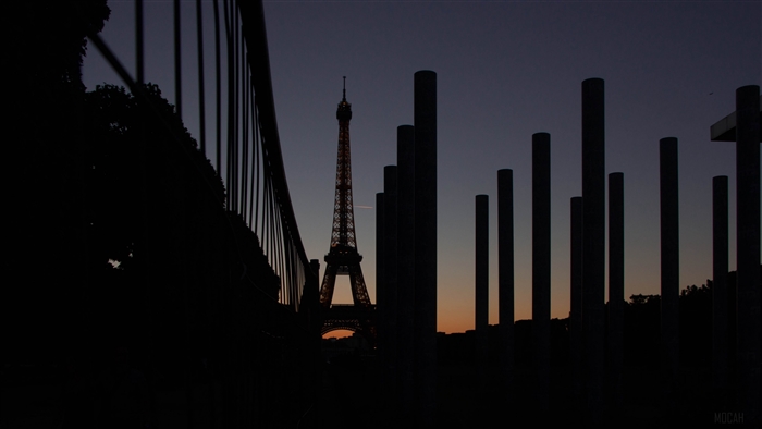 Eiffel Tower at dusk with foreground pillars