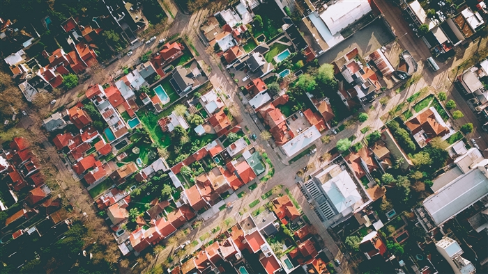 Aerial view of a residential neighborhood with red-tiled roofs