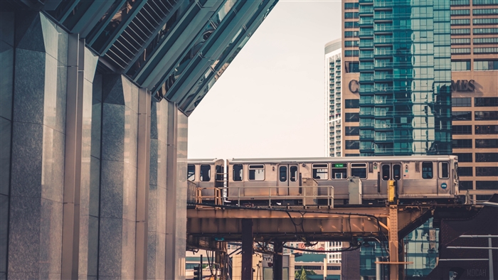 Chicago train passing modern buildings 4K