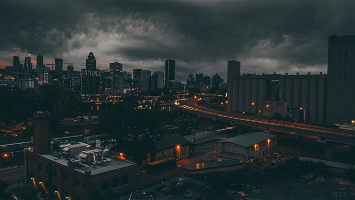 Montreal cityscape at night with stormy clouds