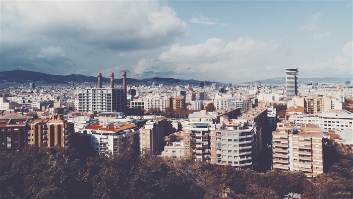 Panorama of Barcelona city with buildings and mountains
