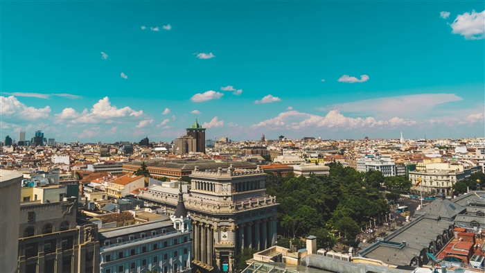 Cityscape with buildings and blue sky, top view 4K