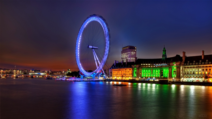 London Eye and buildings at night over the River Thames