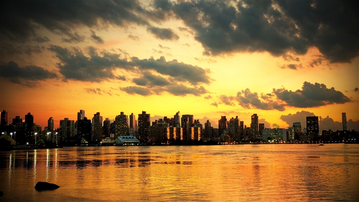 New York City skyline at sunset over the ocean 4K