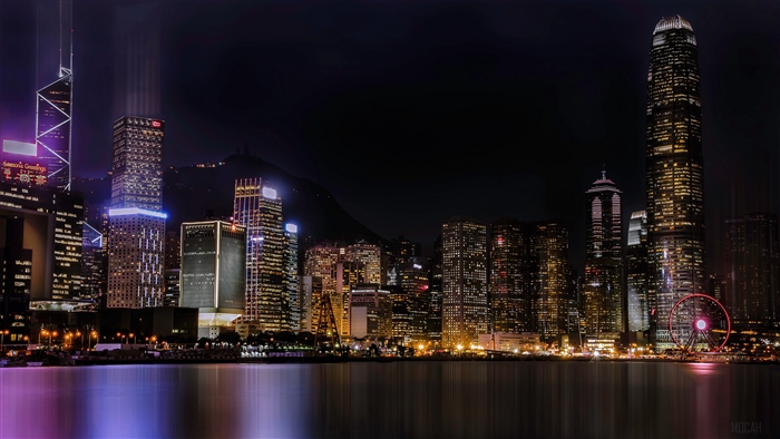 Night cityscape with skyscrapers and Ferris wheel 4K