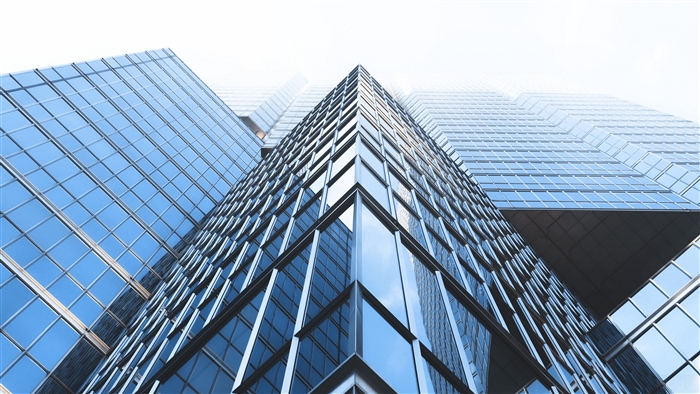 Modern glass skyscrapers in fog 4K