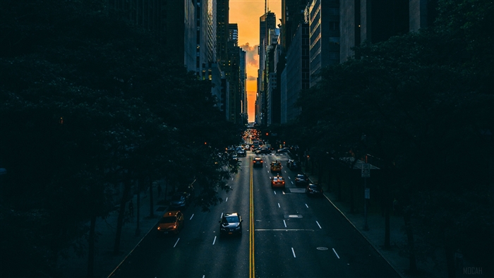 New York City street with skyscrapers and traffic at sunset 4K