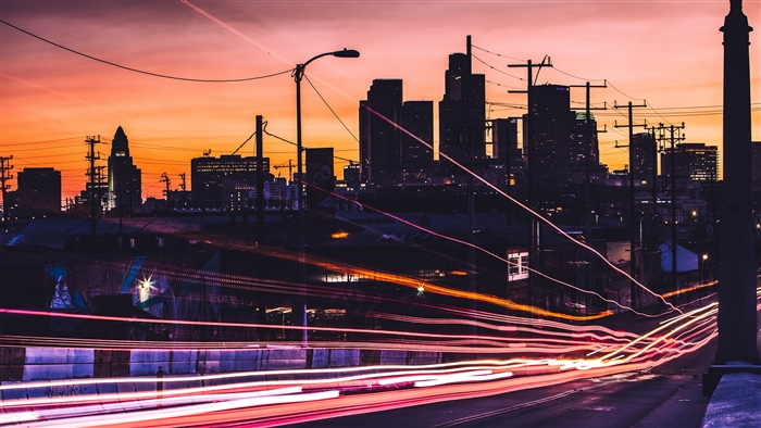City skyline at sunset with light trails