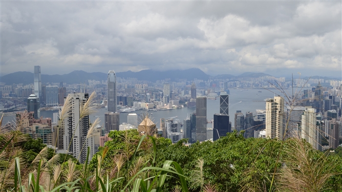 Hong Kong skyline with skyscrapers and mountains 4K