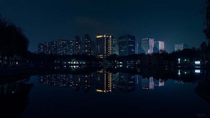 Night city panorama with river reflection 4K