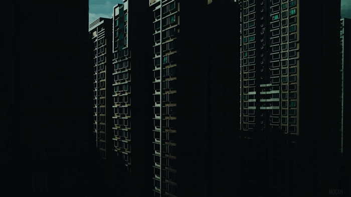 Skyscraper facades in dark urban environment 4K