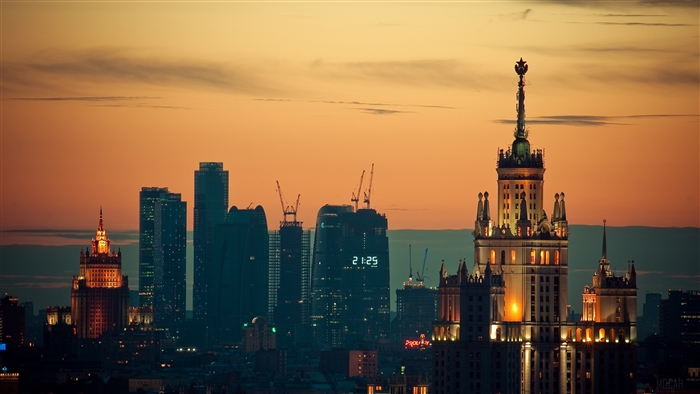 Moscow skyline at sunset with illuminated buildings