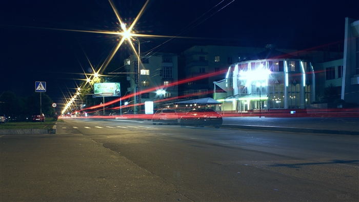 City street at night with car light trails