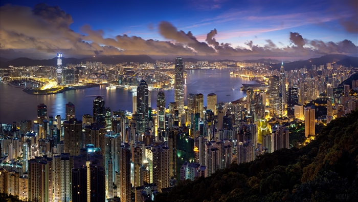 Hong Kong skyline at night with clouds