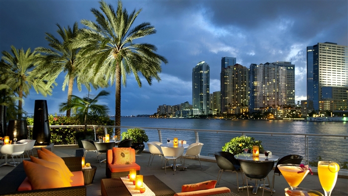 Miami waterfront restaurant with city skyline view 4K