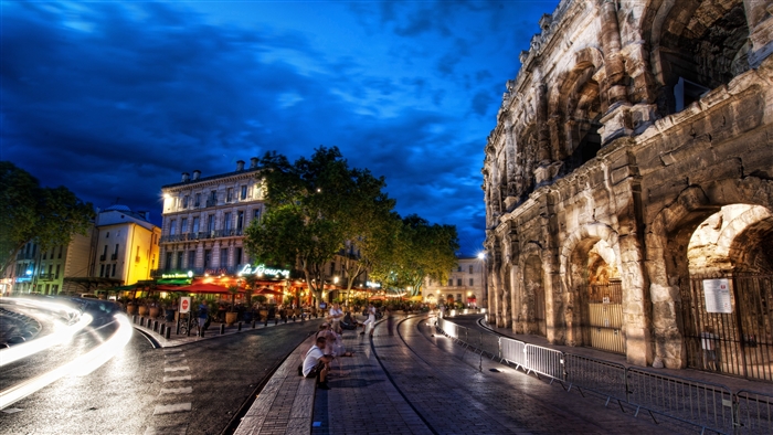 Roman Amphitheatre at Night with Restaurants