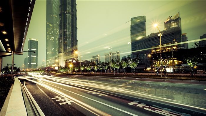 Cityscape with light trails and skyscrapers