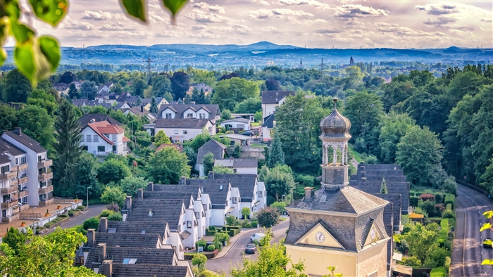 Village with houses and church tower in HDR 4K