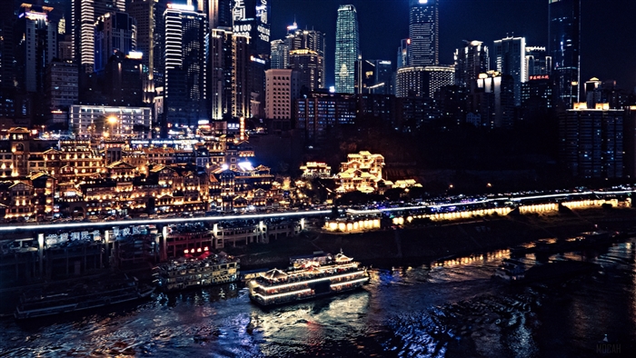 Chongqing China skyscrapers and riverfront buildings at night 4K