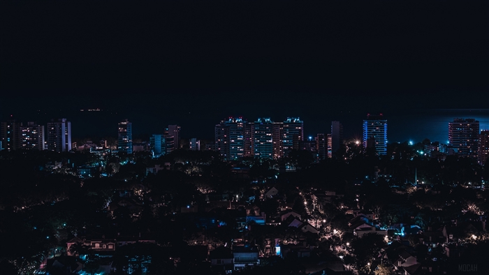 Night city skyline with buildings and city lights in Olivos, Argentina