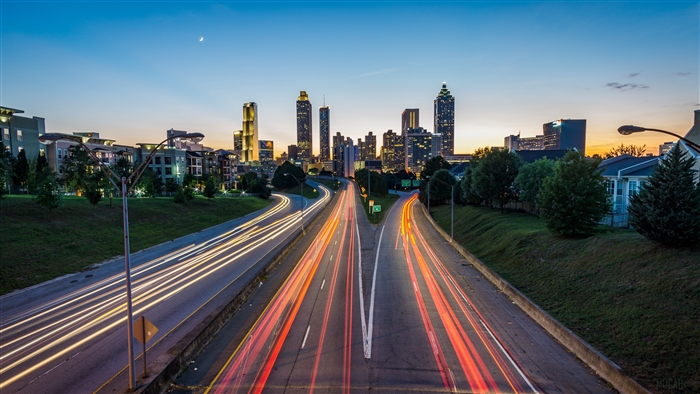 Atlanta skyscrapers and highway light trails at dusk
