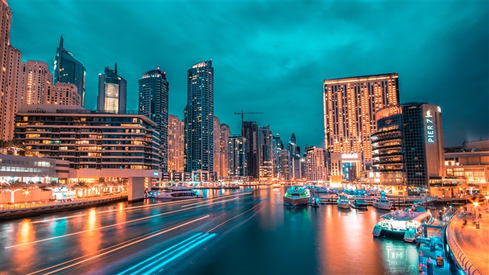 Night city skyline with skyscrapers and port 4K