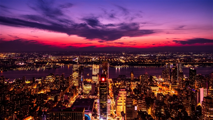 Night city skyline with purple and pink sunset
