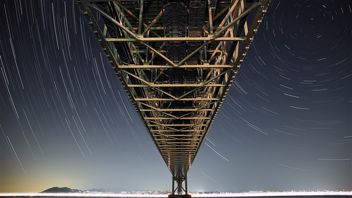 Under the Akashi Kaikyo Bridge at Night with Star Trails