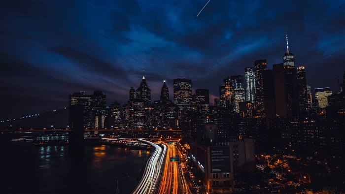 New York City Night Skyline with Bridge and Traffic Lights