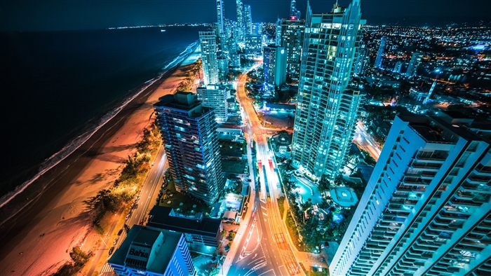 Cityscape with Beach and Ocean at Night 4K